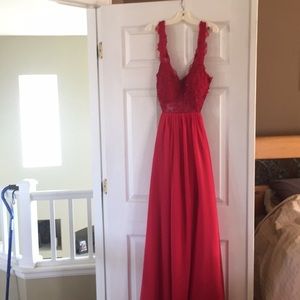 Red prom dress with beading on the chest.